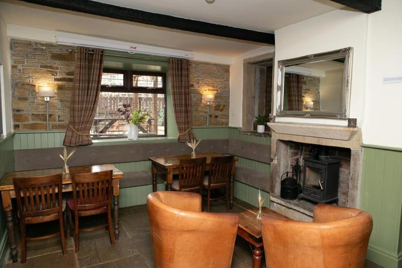 Snug at The Rushcart Inn with log burner and leather chairs